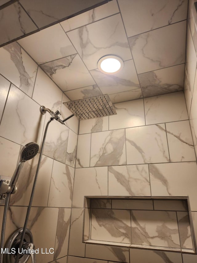 details featuring a tile shower