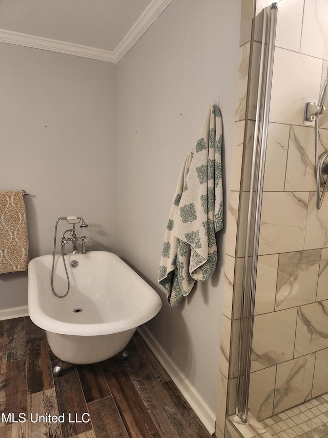 bathroom with ornamental molding and a bathing tub