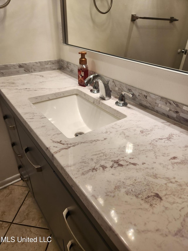 bathroom featuring tile patterned floors and vanity