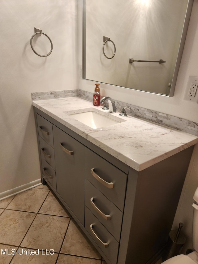 bathroom featuring tile patterned flooring and vanity