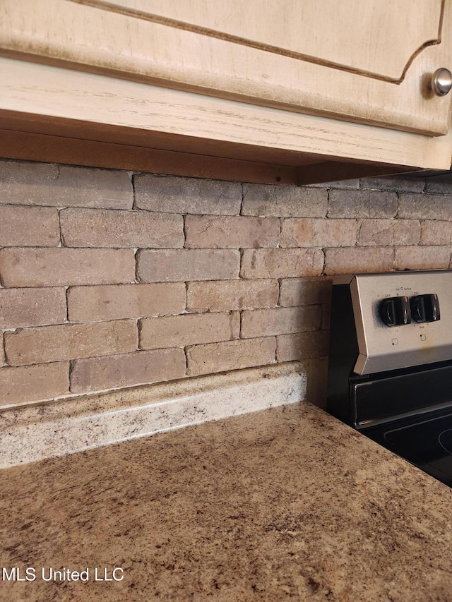 interior details with stainless steel electric stove