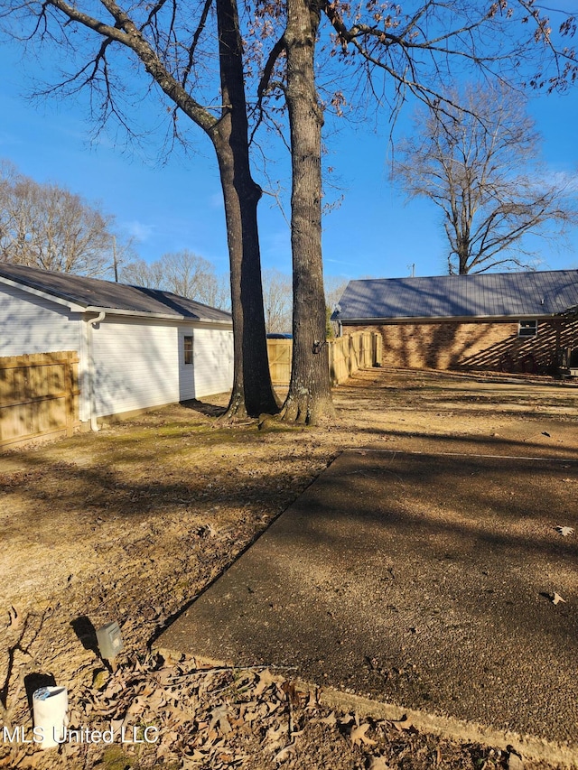 view of side of property featuring a yard