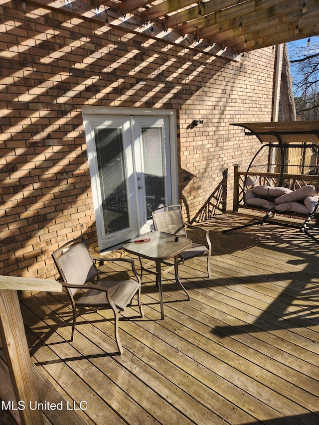 wooden deck with a pergola