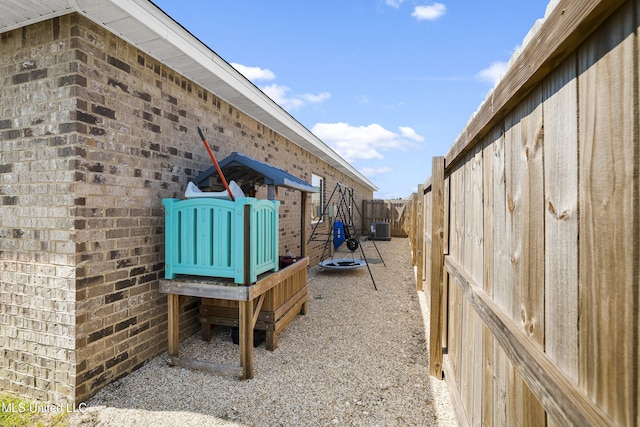 7380 Shearwater Way, Ocean Springs, MS 39564 - view of yard featuring central AC unit and fence