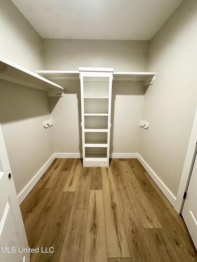 133 Genoa Dr, Madison, MS 39110 - spacious closet featuring wood finished floors