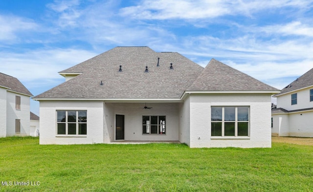 133 Genoa Dr, Madison, MS 39110 - back of property featuring ceiling fan, a lawn, a shingled roof, and stucco siding