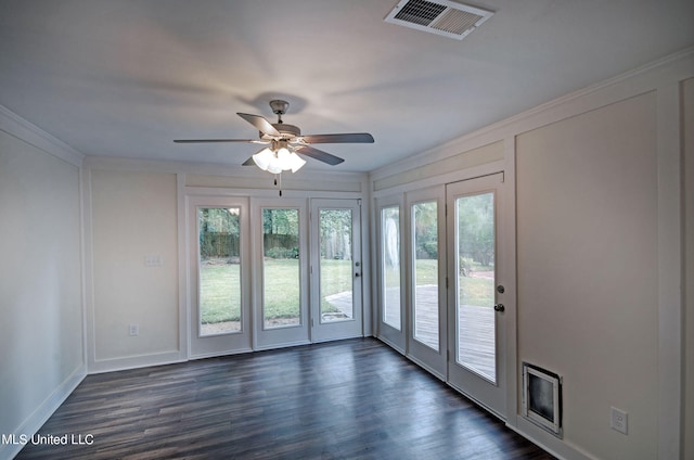 interior space featuring ornamental molding, dark hardwood / wood-style floors, and ceiling fan