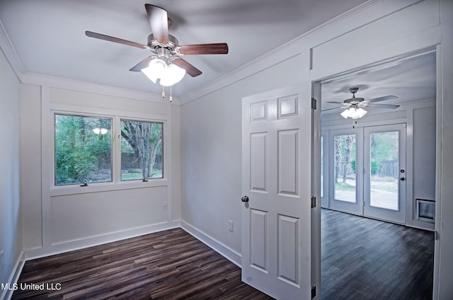 interior space with crown molding, a healthy amount of sunlight, dark wood-type flooring, and ceiling fan