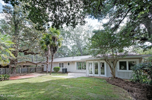 back of house with a yard, a patio, and cooling unit