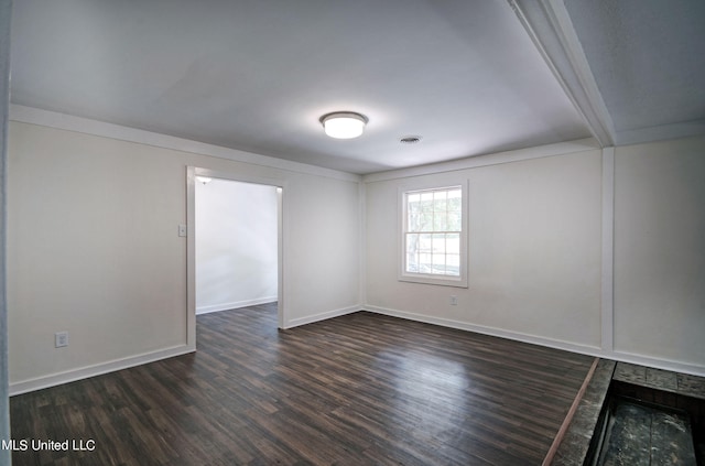 empty room with dark hardwood / wood-style floors