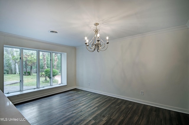 empty room with crown molding, a chandelier, and dark hardwood / wood-style flooring