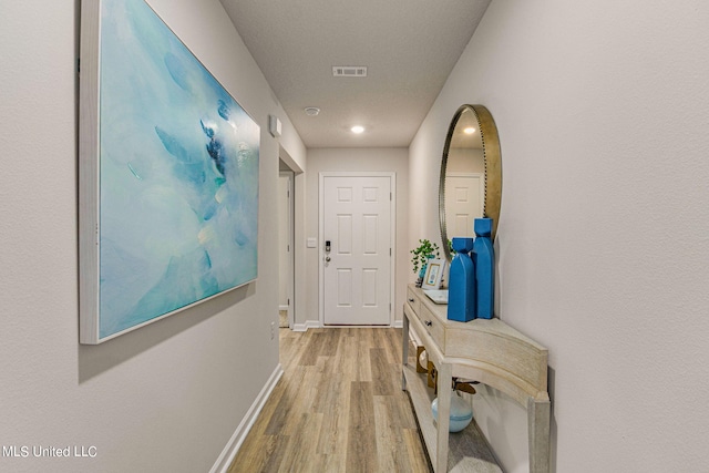 hall featuring light hardwood / wood-style floors