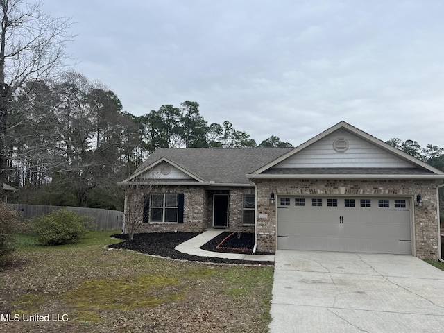 view of front of home featuring fence, brick siding, a garage, and driveway