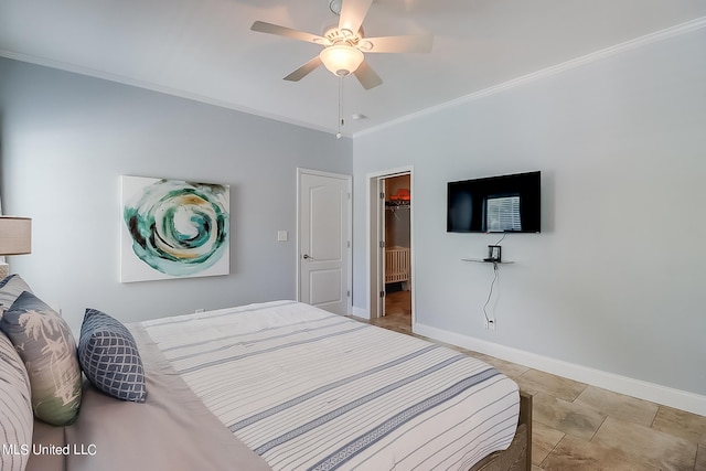 bedroom featuring a closet, ornamental molding, a spacious closet, and ceiling fan