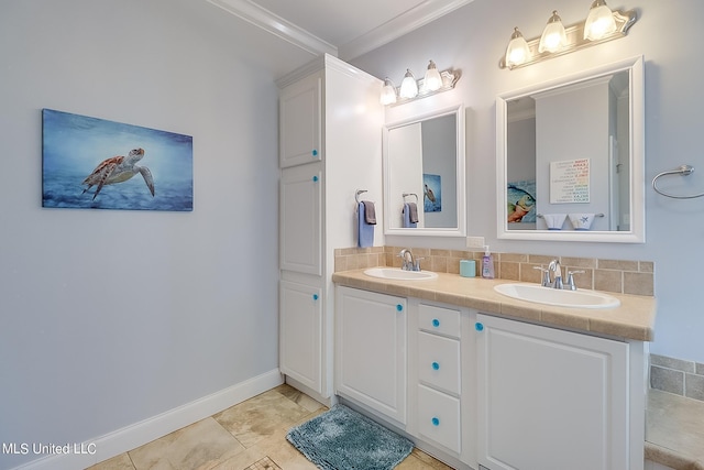 112 Vista Dr, Pass Christian, MS 39571 - bathroom with a sink, baseboards, crown molding, and double vanity