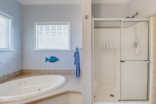 bathroom featuring shower with separate bathtub