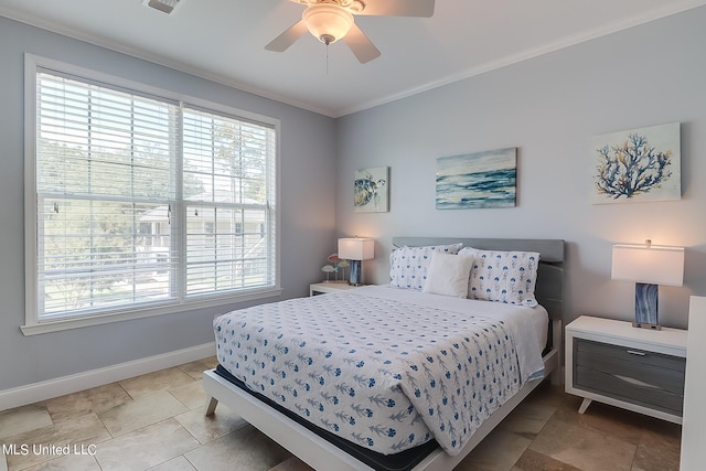 bedroom with ceiling fan, crown molding, and multiple windows