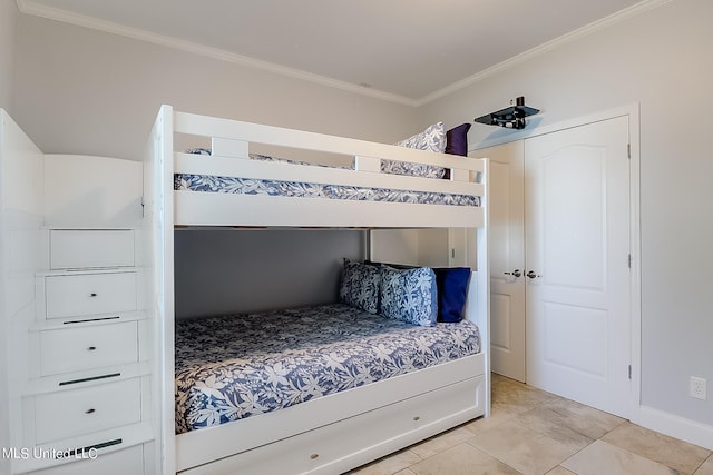 112 Vista Dr, Pass Christian, MS 39571 - bedroom featuring crown molding, light tile patterned flooring, and baseboards