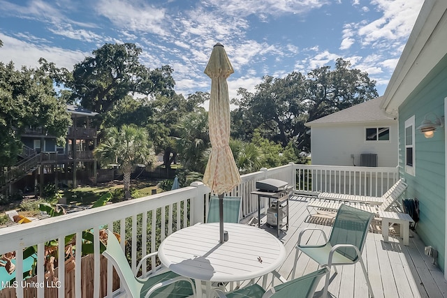 112 Vista Dr, Pass Christian, MS 39571 - wooden deck with area for grilling, cooling unit, and outdoor dining area