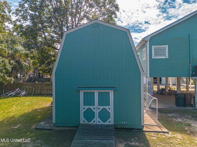 view of outbuilding featuring a yard