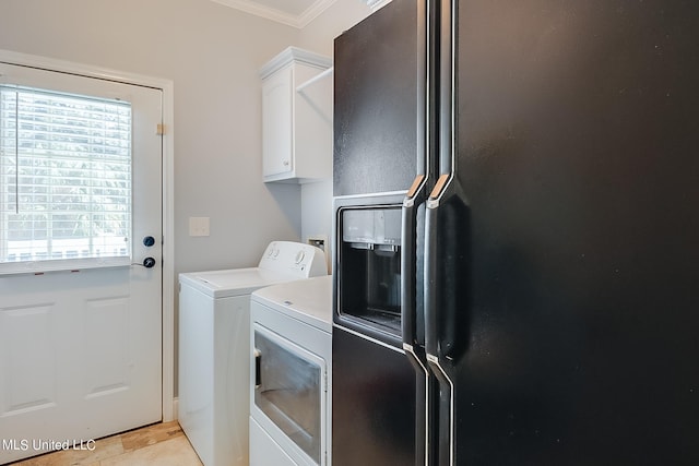 112 Vista Dr, Pass Christian, MS 39571 - laundry room featuring crown molding, cabinet space, and independent washer and dryer