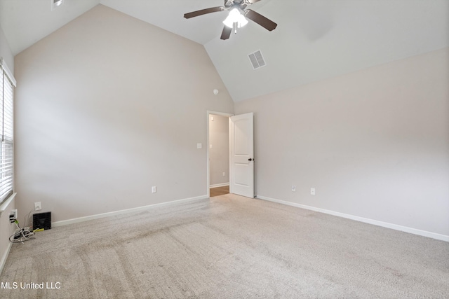 spare room featuring high vaulted ceiling, a ceiling fan, carpet flooring, and baseboards