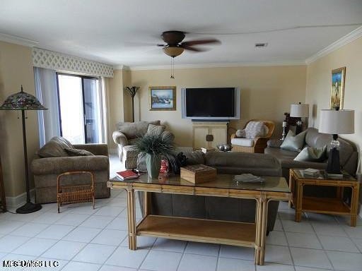 living room with ornamental molding, light tile patterned floors, and ceiling fan