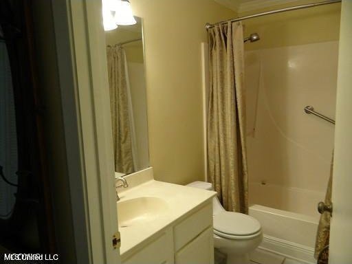 full bathroom featuring vanity, shower / bath combo, toilet, and tile patterned flooring