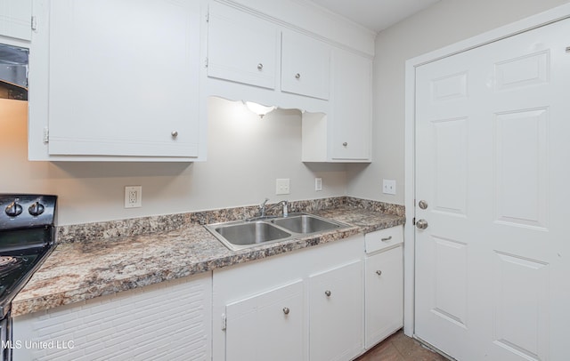 27 Wisteria Ct, Jackson, MS 39204 - kitchen with a sink, range with electric cooktop, and white cabinetry