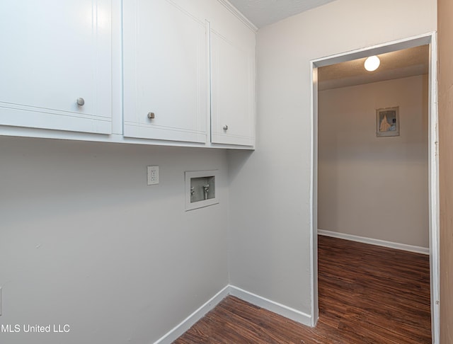 27 Wisteria Ct, Jackson, MS 39204 - laundry room with dark wood-type flooring, washer hookup, baseboards, and cabinet space