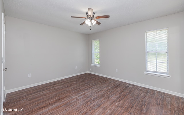 27 Wisteria Ct, Jackson, MS 39204 - empty room featuring dark wood-style flooring, ceiling fan, and baseboards