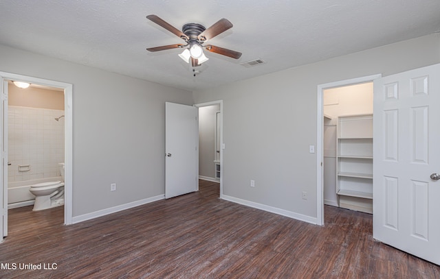 27 Wisteria Ct, Jackson, MS 39204 - unfurnished bedroom featuring wood finished floors, a spacious closet, baseboards, and a closet