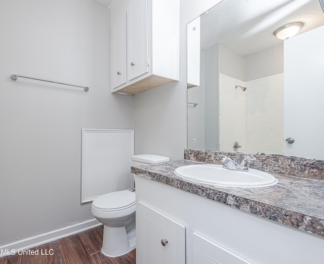 27 Wisteria Ct, Jackson, MS 39204 - full bath featuring toilet, vanity, wood finished floors, a shower, and baseboards