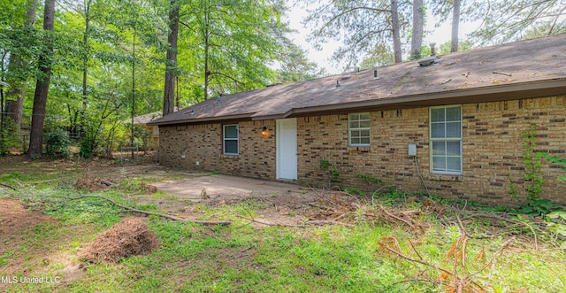 27 Wisteria Ct, Jackson, MS 39204 - back of property featuring brick siding and a patio area