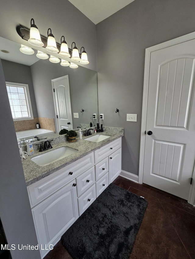 305 Flagstone Dr, Brandon, MS 39042 - full bathroom with double vanity, tile patterned floors, and a tub to relax in