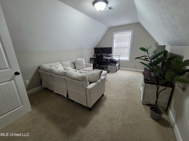 305 Flagstone Dr, Brandon, MS 39042 - living area featuring carpet, vaulted ceiling, and a textured ceiling