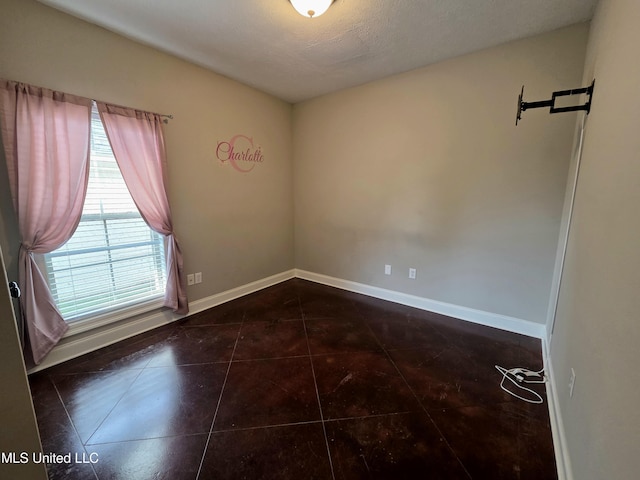 305 Flagstone Dr, Brandon, MS 39042 - tiled empty room with baseboards