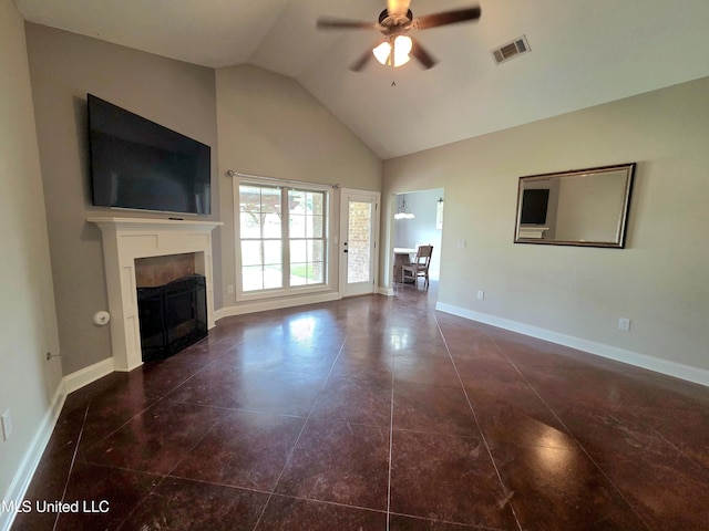 305 Flagstone Dr, Brandon, MS 39042 - unfurnished living room featuring a tiled fireplace, a ceiling fan, high vaulted ceiling, and tile patterned flooring