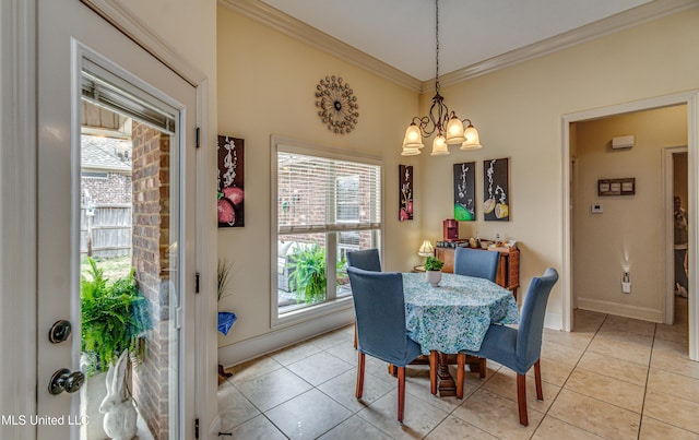 dining area featuring light tile patterned flooring, a wealth of natural light, and crown molding