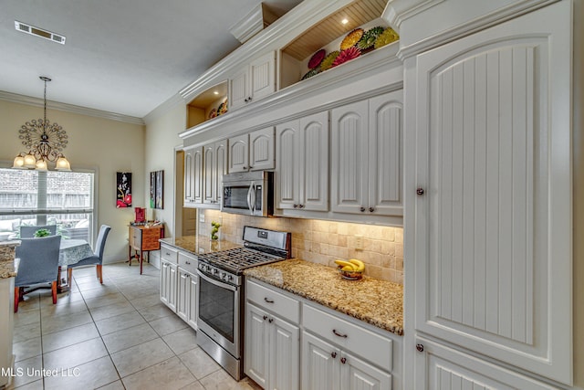 kitchen featuring light tile patterned floors, tasteful backsplash, visible vents, ornamental molding, and stainless steel appliances