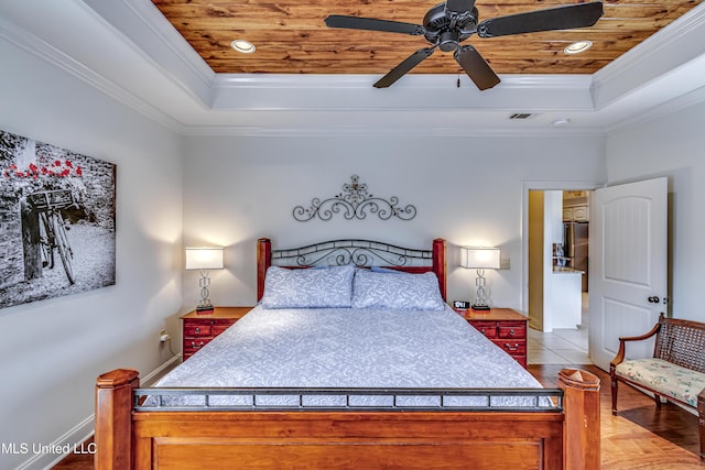 tiled bedroom featuring visible vents, a raised ceiling, and wood ceiling