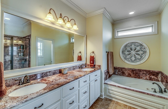 bathroom with crown molding, a sink, a jetted tub, and double vanity