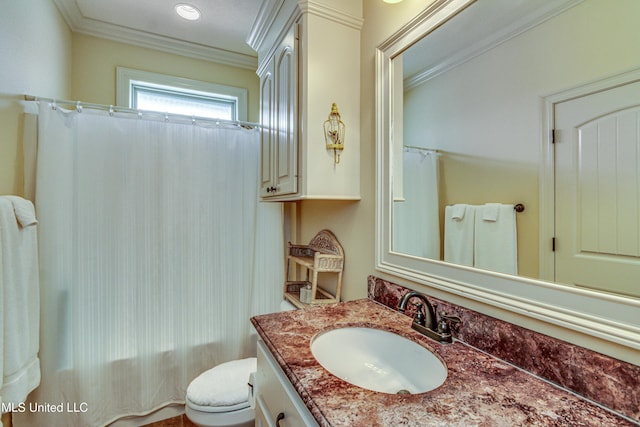 full bathroom featuring toilet, vanity, and crown molding