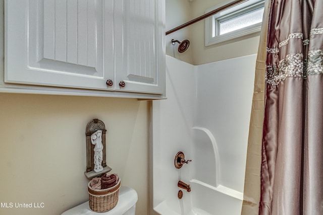 bathroom with shower / bathtub combination with curtain