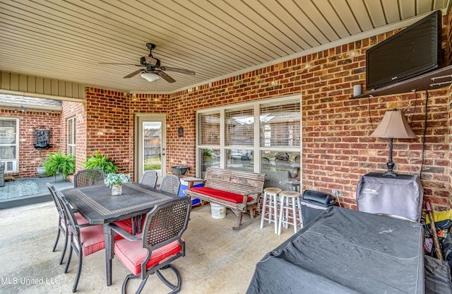 view of patio featuring ceiling fan and outdoor dining space