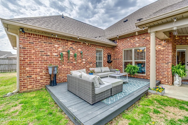 exterior space with a deck, fence, and an outdoor hangout area