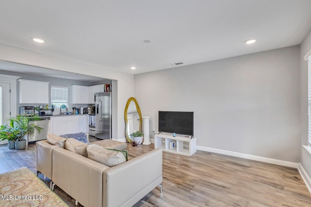 living room with light wood-type flooring