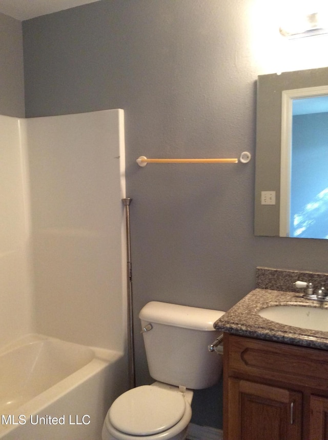 full bathroom featuring shower / bathing tub combination, vanity, and toilet