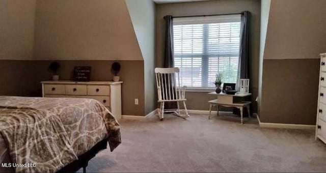 bedroom featuring carpet and baseboards