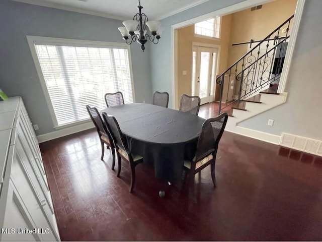 dining room with stairs, ornamental molding, visible vents, and baseboards